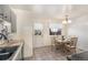 Charming kitchen with breakfast nook and a wooden table set for four at 9731 W Polk Dr, Littleton, CO 80123