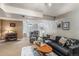 Finished basement living room with a comfortable seating area and recessed lighting at 9731 W Polk Dr, Littleton, CO 80123