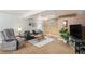 Finished basement living room with a comfortable seating area and recessed lighting at 9731 W Polk Dr, Littleton, CO 80123
