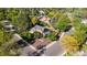 Aerial view of a home on corner lot featuring mature trees and professional landscaping at 308 Oswego St, Aurora, CO 80010