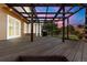 Large back deck with pergola and outdoor grill with sunset in the background at 308 Oswego St, Aurora, CO 80010