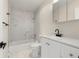Updated bathroom with a combined tub and shower and a modern vanity and fixtures at 308 Oswego St, Aurora, CO 80010