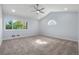 Vaulted ceiling bedroom with a window view and neutral-toned carpeting at 308 Oswego St, Aurora, CO 80010