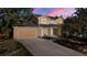 Inviting home featuring a spacious driveway and attached garage at 308 Oswego St, Aurora, CO 80010