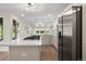 Modern kitchen with stainless steel appliances and white cabinetry at 308 Oswego St, Aurora, CO 80010