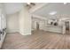 Spacious open-concept living area with modern lighting fixtures and access to the kitchen at 308 Oswego St, Aurora, CO 80010