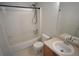 The bathroom features a shower and tub combo with a vanity and sink at 5023 Goshawk Ct, Brighton, CO 80601