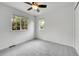 Bright bedroom with natural light streaming through windows at 5023 Goshawk Ct, Brighton, CO 80601