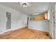 Open dining area with hardwood floors next to the kitchen and pantry at 5023 Goshawk Ct, Brighton, CO 80601