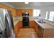 Updated kitchen with stainless steel appliances, oak cabinets, and plenty of counter space at 5023 Goshawk Ct, Brighton, CO 80601