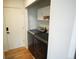Modern laundry room features gray washer/dryer and storage cabinets at 5023 Goshawk Ct, Brighton, CO 80601