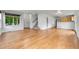 Spacious living room boasting gleaming hardwood floors, a staircase, and natural light from the windows at 5023 Goshawk Ct, Brighton, CO 80601