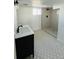 Bathroom with tiled shower, modern fixtures, and vanity at 17362 County Road 29, Platteville, CO 80651