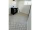 Bathroom showcasing patterned tile, vanity and toilet at 17362 County Road 29, Platteville, CO 80651