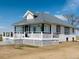 Charming farmhouse with metal roof, covered porch and black trim at 17362 County Road 29, Platteville, CO 80651