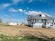 Exterior of home with a gray roof and white trim sitting on a large lot at 17362 County Road 29, Platteville, CO 80651
