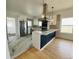 Updated kitchen with eat in island, gas range and updated appliances at 17362 County Road 29, Platteville, CO 80651