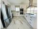 Modern kitchen featuring stainless steel appliances and marble flooring at 17362 County Road 29, Platteville, CO 80651