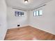 Bright bedroom with hardwood floors and large windows at 1130 Locust St, Denver, CO 80220