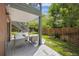 Spacious back deck with outdoor seating next to the fenced-in backyard and staircase at 761 Carr St, Lakewood, CO 80214