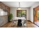 Cozy dining room with natural light, modern furnishings, and a walkout deck at 761 Carr St, Lakewood, CO 80214