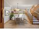 Charming dining area with view of the second story and a staircase at 761 Carr St, Lakewood, CO 80214