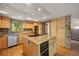 Well-equipped kitchen with an island, stainless steel appliances, and granite countertops at 761 Carr St, Lakewood, CO 80214