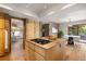 Modern kitchen island with a stove and plenty of counter space at 761 Carr St, Lakewood, CO 80214