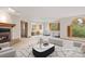 Bright living room with fireplace, large windows, and modern furnishings at 761 Carr St, Lakewood, CO 80214