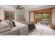 Bright and airy main bedroom with a private balcony offering scenic views, ample closet space at 761 Carr St, Lakewood, CO 80214