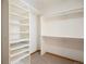 Organized walk-in closet with custom shelving and ample storage for clothes, shoes and personal items at 761 Carr St, Lakewood, CO 80214