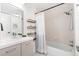 Inviting bathroom featuring modern fixtures, tub, shower, and convenient wall shelving at 5300 E Cherry Creek South Dr # 1227, Denver, CO 80246