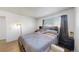 Bright bedroom with a comfortable bed and ample floor space at 1242 S Crystal Way, Aurora, CO 80012