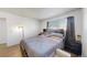 Bedroom with a large bed and good lighting at 1242 S Crystal Way, Aurora, CO 80012