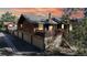 Inviting home features a deck, three-car garage, and wood exterior at 1242 S Crystal Way, Aurora, CO 80012
