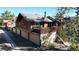 Exterior view featuring a deck with outdoor furniture and a garage at 1242 S Crystal Way, Aurora, CO 80012