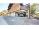 View of a spacious garage equipped with storage and a car parked inside at 1242 S Crystal Way, Aurora, CO 80012