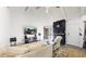 Cozy living room with stone fireplace, a vaulted ceiling, and ample natural light at 1242 S Crystal Way, Aurora, CO 80012