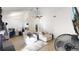 Bright living room with neutral color palette, vaulted ceiling, and hardwood floors at 1242 S Crystal Way, Aurora, CO 80012