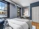 Comfortable bedroom features large windows offering natural light, and modern amenities at 740 N Sherman St # 208, Denver, CO 80203
