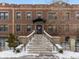 Building with stone stairs leading to entrance, brick facade, and 'ICON 740' sign at 740 N Sherman St # 208, Denver, CO 80203