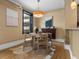 Cozy dining area with round table and cowhide rug next to the window at 740 N Sherman St # 208, Denver, CO 80203