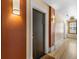 Hallway view of a unit door with contemporary lighting and neutral color palette at 740 N Sherman St # 208, Denver, CO 80203