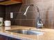 Chrome kitchen faucet, light countertops, and brown subway tile backsplash at 740 N Sherman St # 208, Denver, CO 80203
