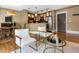 Stylish living area featuring modern furniture, a well-lit kitchen, and hardwood floors at 740 N Sherman St # 208, Denver, CO 80203