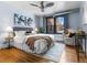 Well-lit bedroom with a large window and a cozy sitting area at 740 N Sherman St # 208, Denver, CO 80203