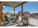 Outdoor dining area with a grill, and city views under a covered patio at 740 N Sherman St # 208, Denver, CO 80203