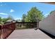 Wooden deck with a view of the neighborhood and mature trees at 11358 W 85Th Pl # E, Arvada, CO 80005