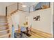 Dining Room features a staircase with sleek metal railings and an open design that enhances the home's bright interior at 11358 W 85Th Pl # E, Arvada, CO 80005