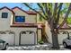 Multi-Gathering townhome with three units, red tile roofs, stucco exteriors, garages and landscaped front yards at 11358 W 85Th Pl # E, Arvada, CO 80005